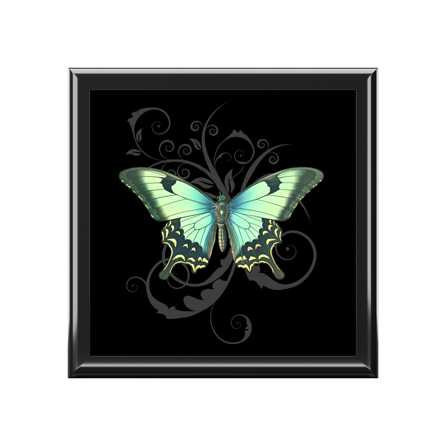 Framed artwork of a green butterfly on a black background