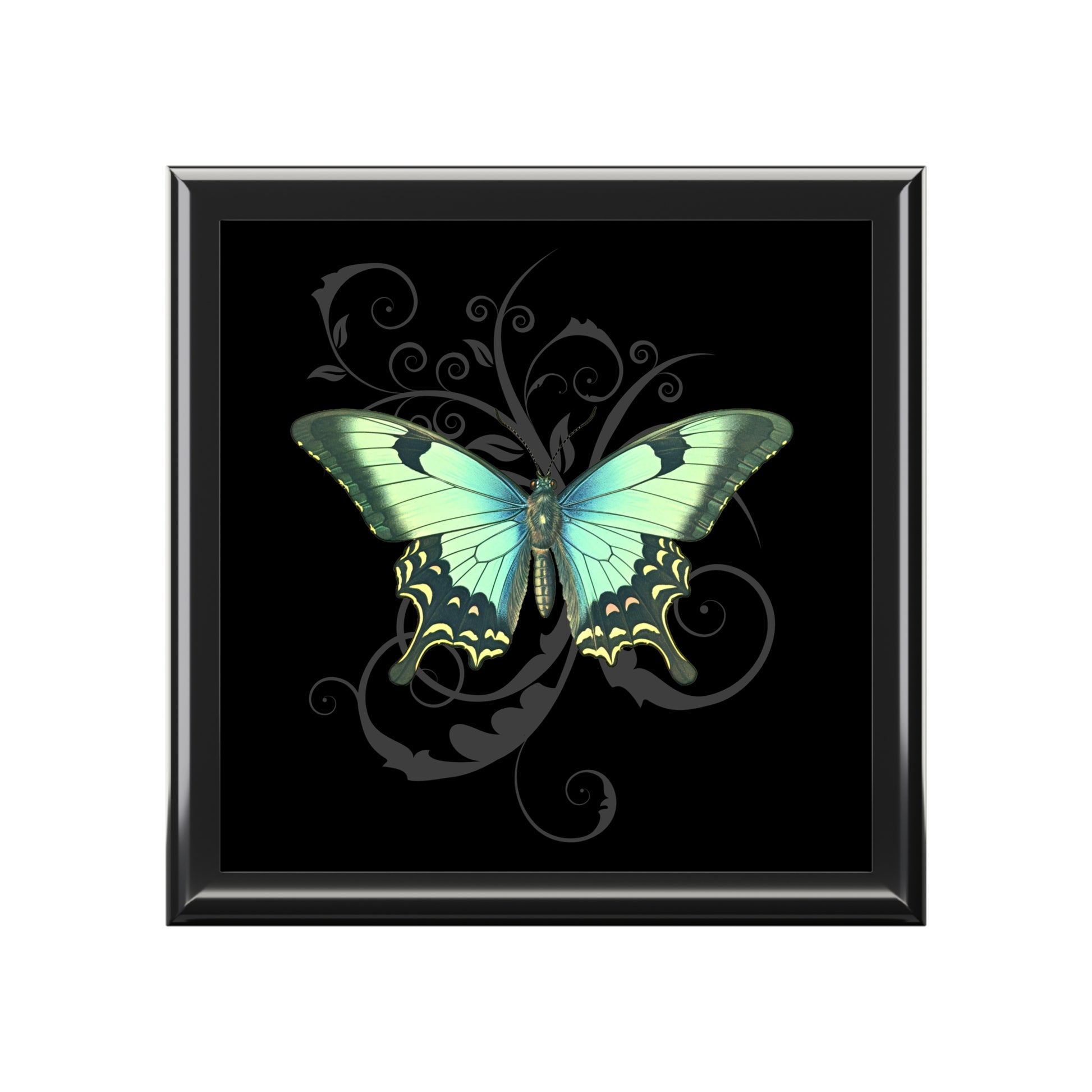 Framed artwork of a green butterfly on a black background