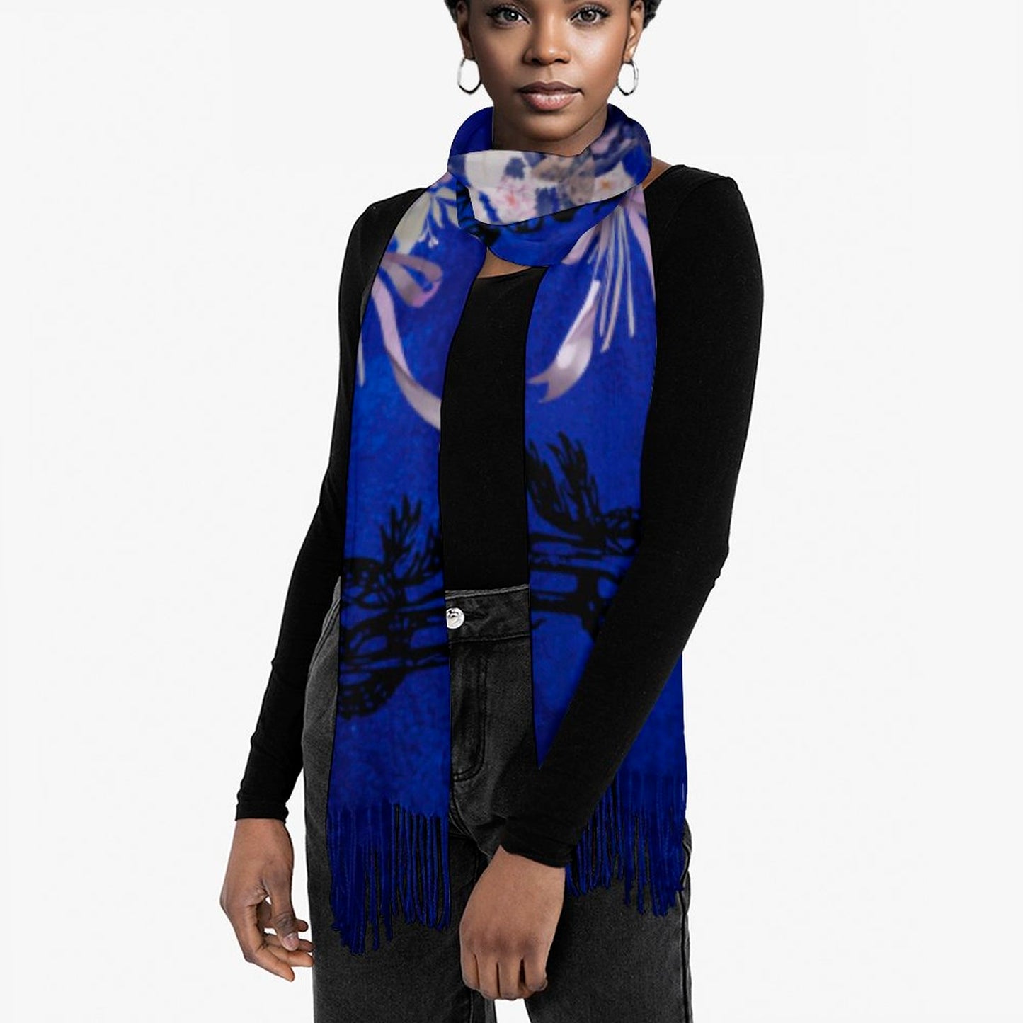 Woman wearing a blue scarf with fringe details on a white background