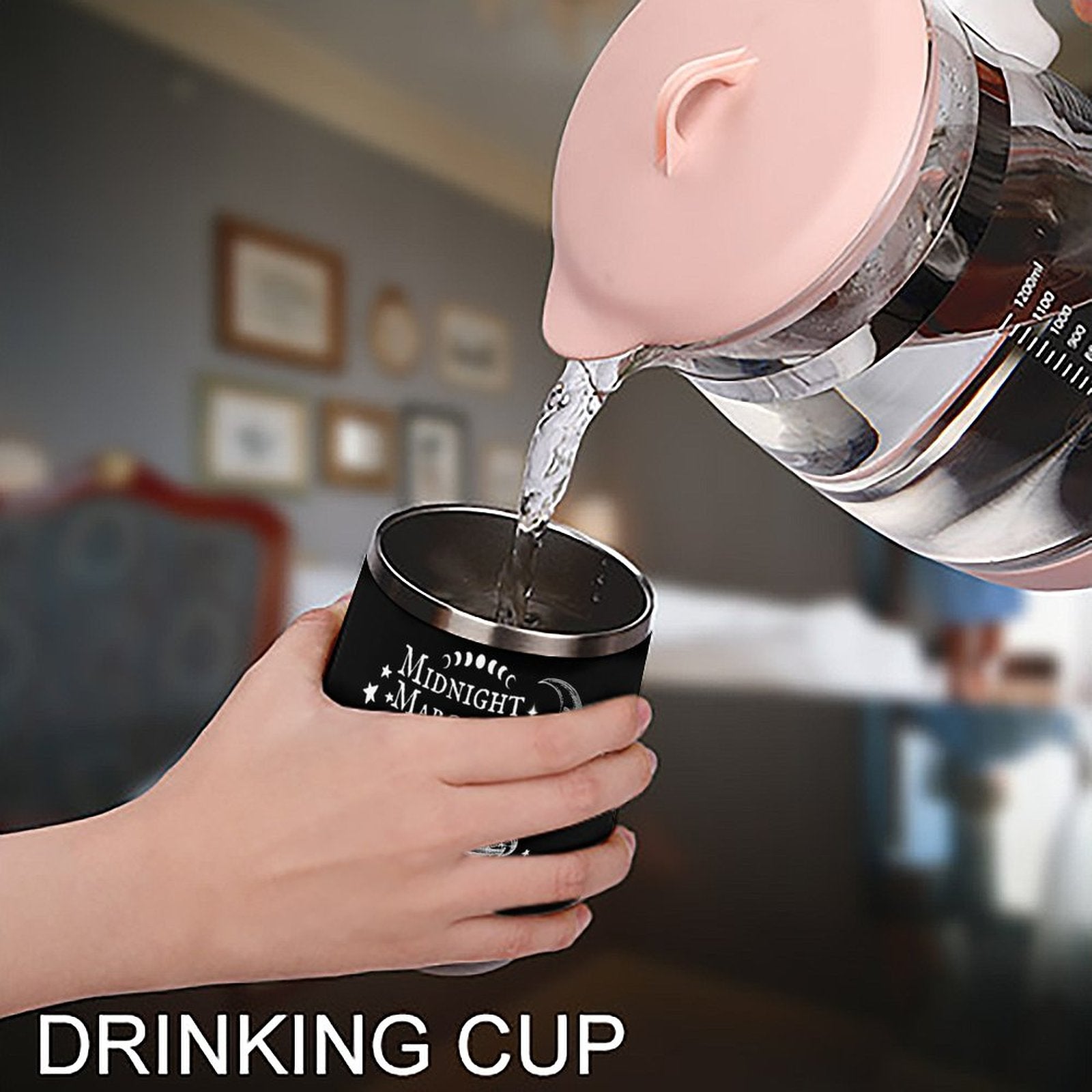 Person pouring water from a pink kettle into a black drinking cup with 'Midnight Moon' branding.