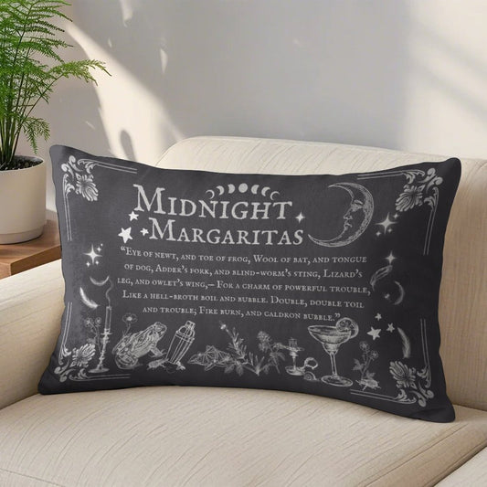 Decorative pillow with 'Midnight Margaritas' text and illustrations on a couch.