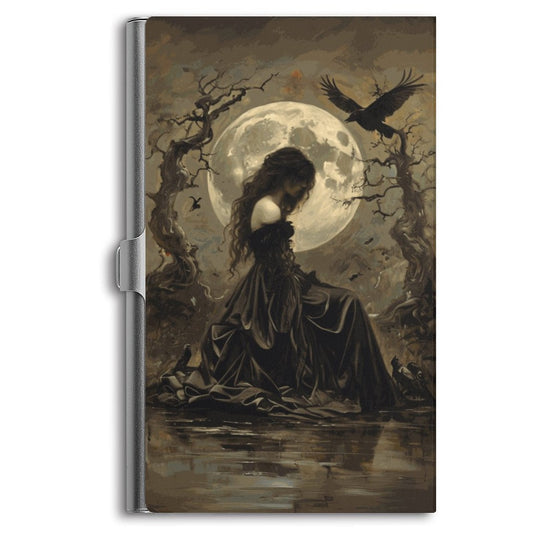 Notebook cover with a woman in a dark dress sitting by water, surrounded by trees and a full moon.