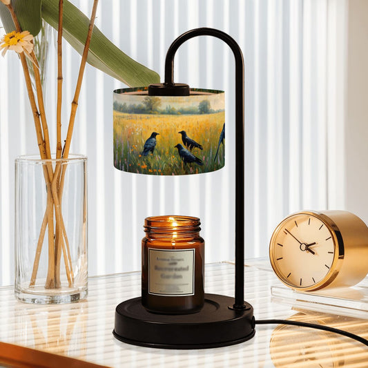 Table lamp with bird design shade on a desk next to a candle and clock