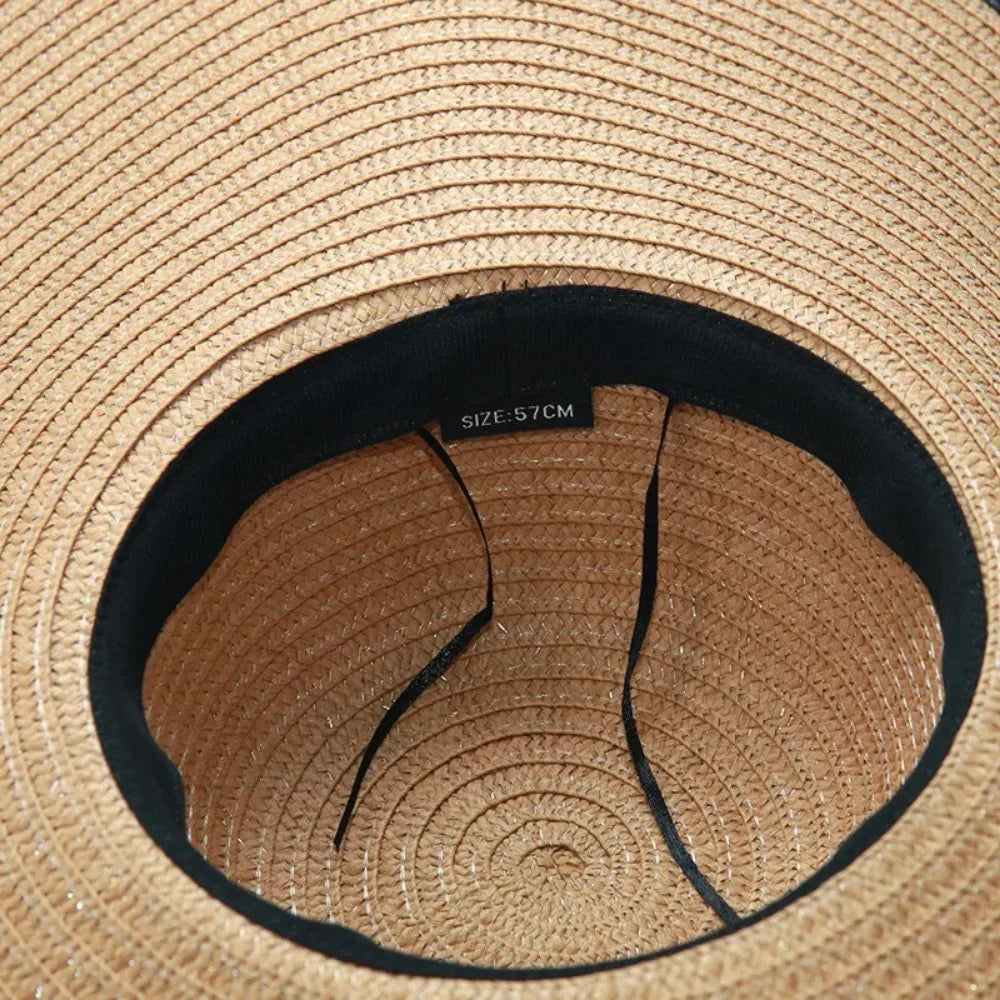 Close-up of a straw hat with a visible brand label.