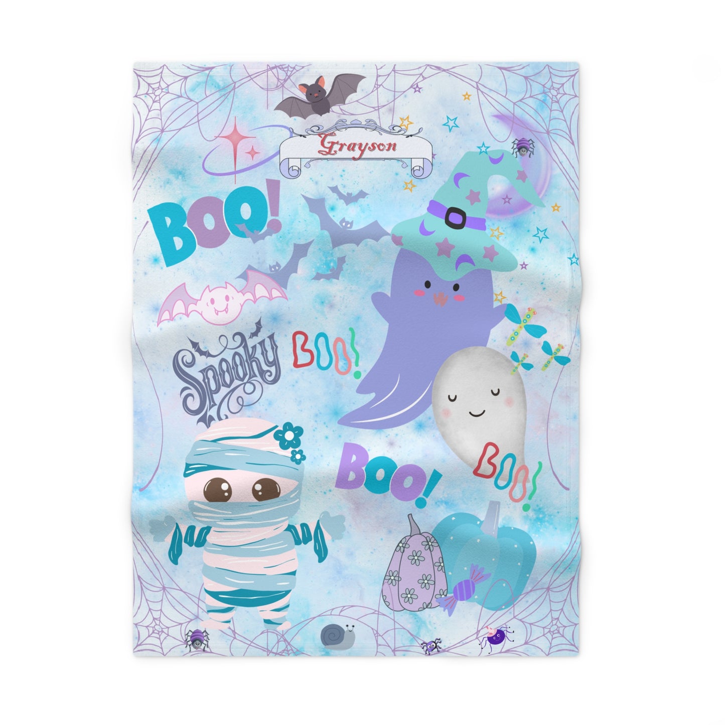 Children's Halloween-themed blanket with cartoon characters and text on a light blue background.