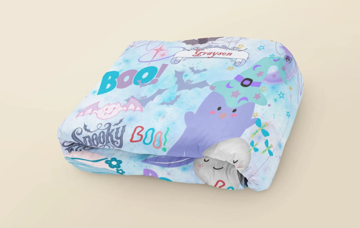 Children's pillow with cartoon characters and text on a beige background