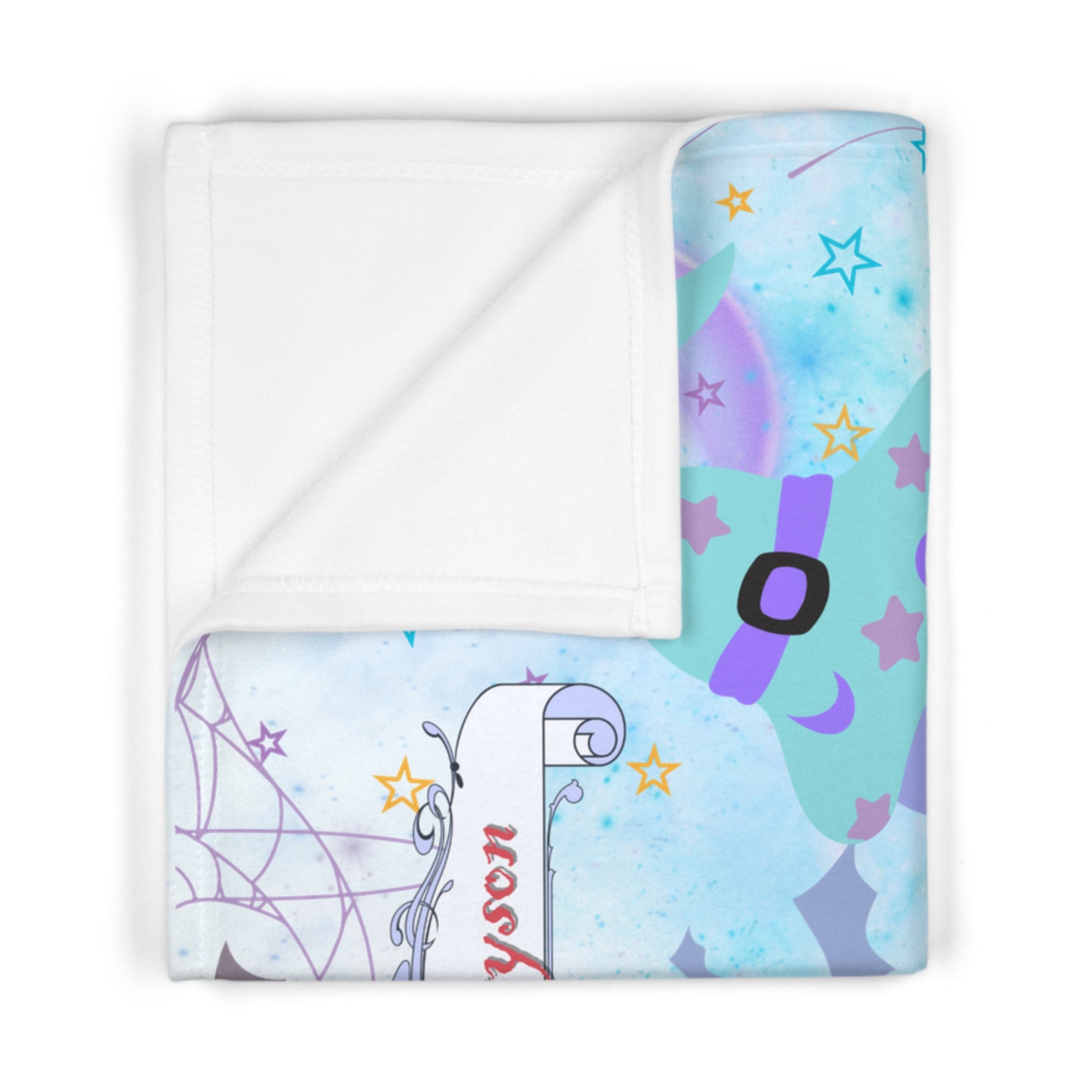Folded blanket with cartoon Halloween  design on a white background