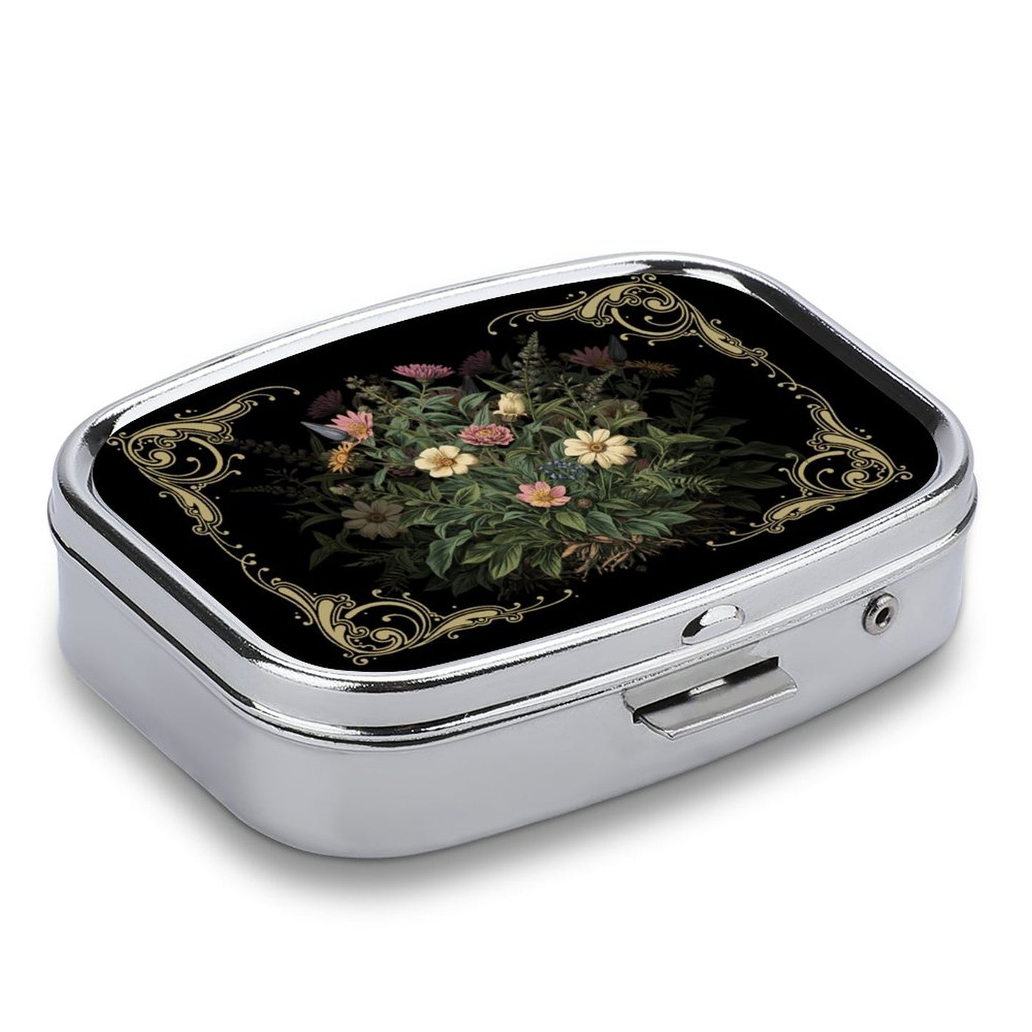 Decorative pill box with floral design on a black background