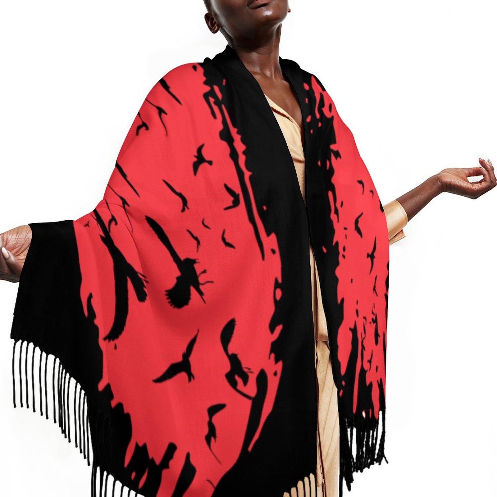 Person wearing a red and black patterned scarf with fringes on a white background