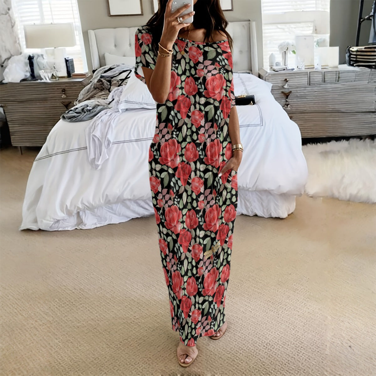 Person wearing a floral dress in a bedroom setting