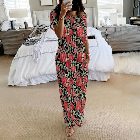 Person wearing a floral dress in a bedroom setting