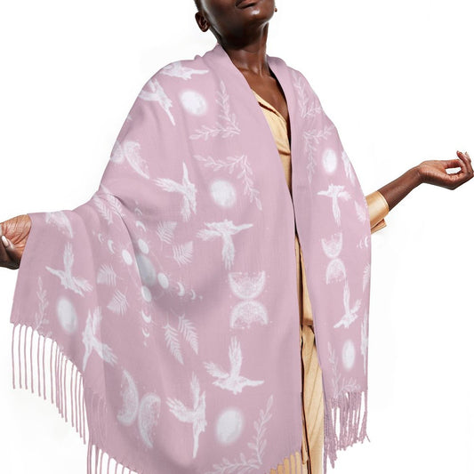 Woman wearing a light pink scarf with white patterns on a white background