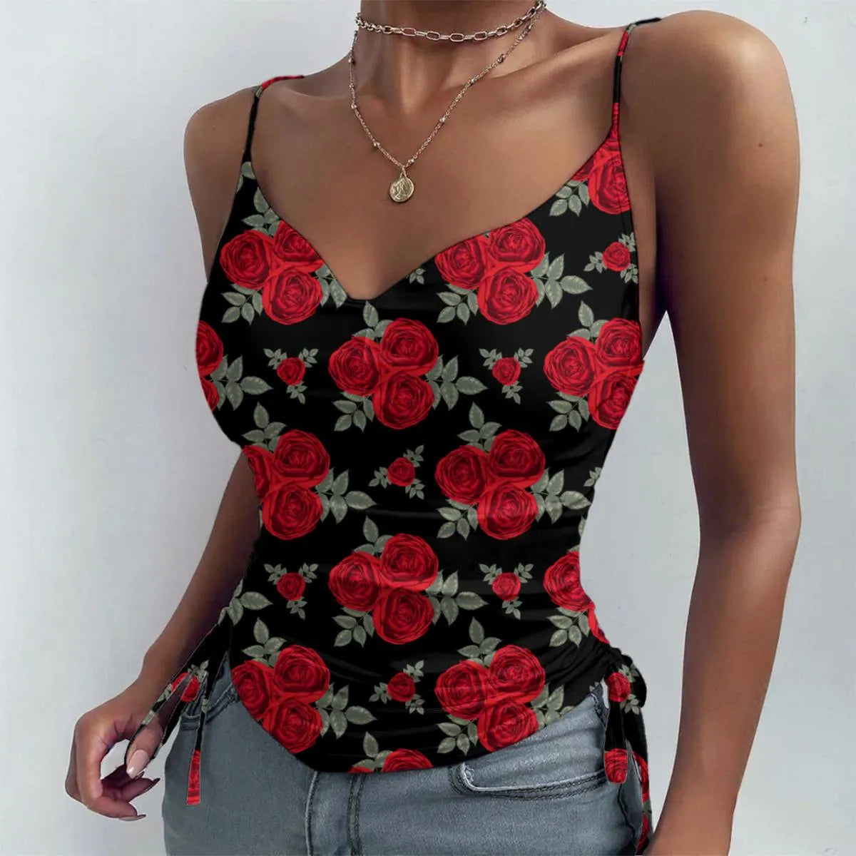 Black tank top with red rose pattern worn by a person on a white background