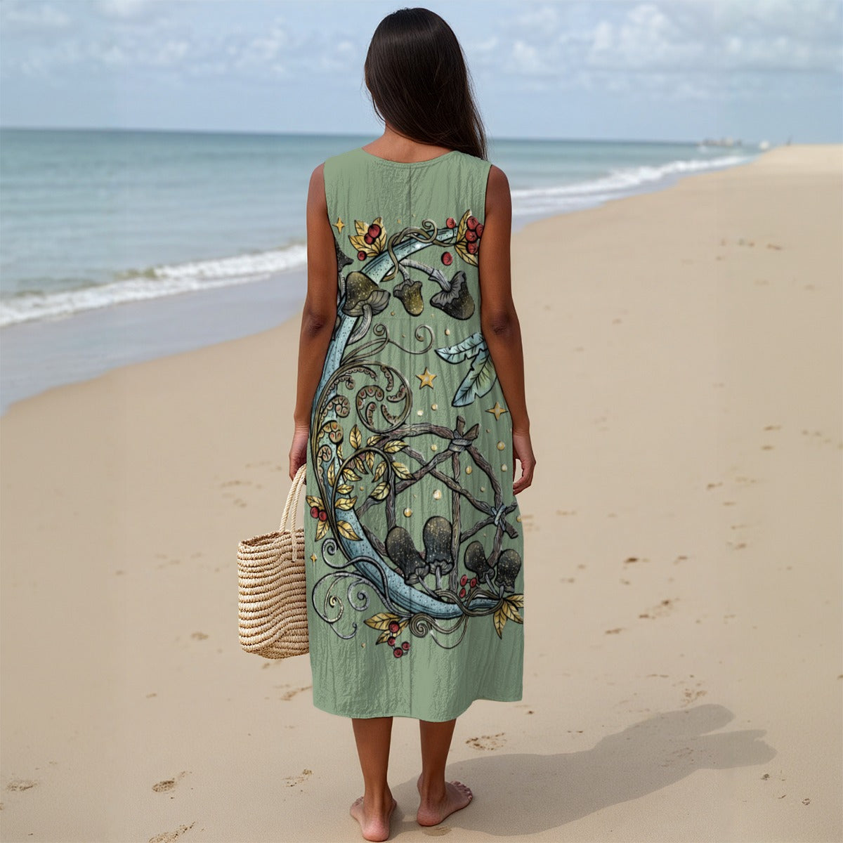 Woman in a green dress with butterfly design on a beach