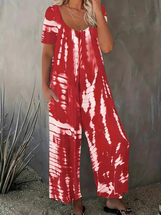 Red and white tie-dye jumpsuit worn by a person against a neutral background