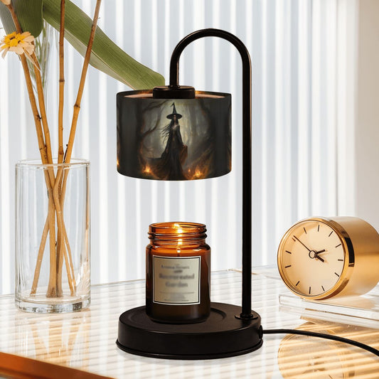 Table lamp with a candle on a surface next to a clock and vase with plants