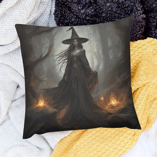 Pillow with a witch design in a dark forest setting