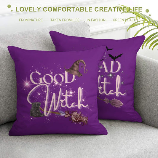 Purple pillows with 'Good Witch' text on a gray couch.