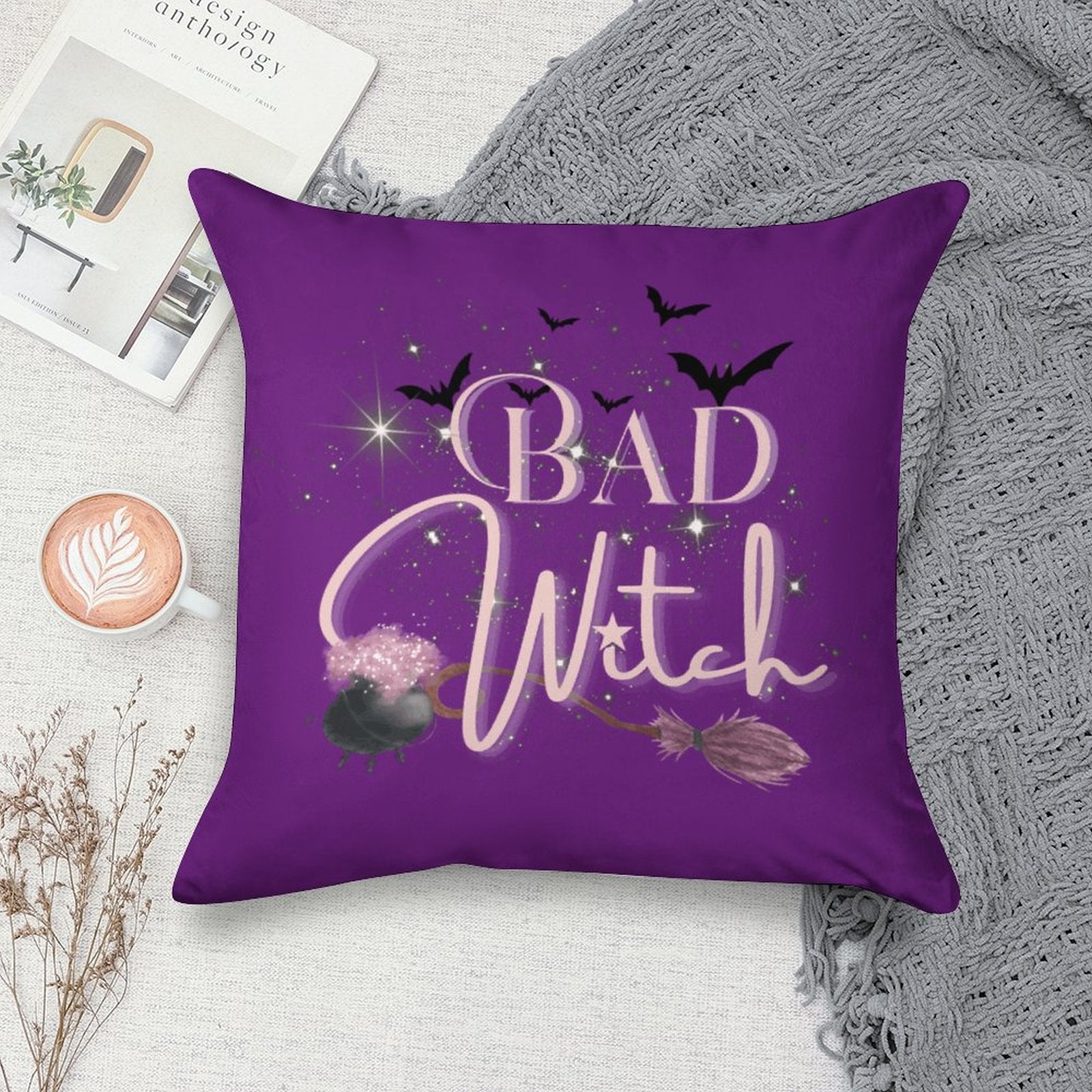 Purple pillow with 'Bad Witch' text and Halloween elements on a textured surface.