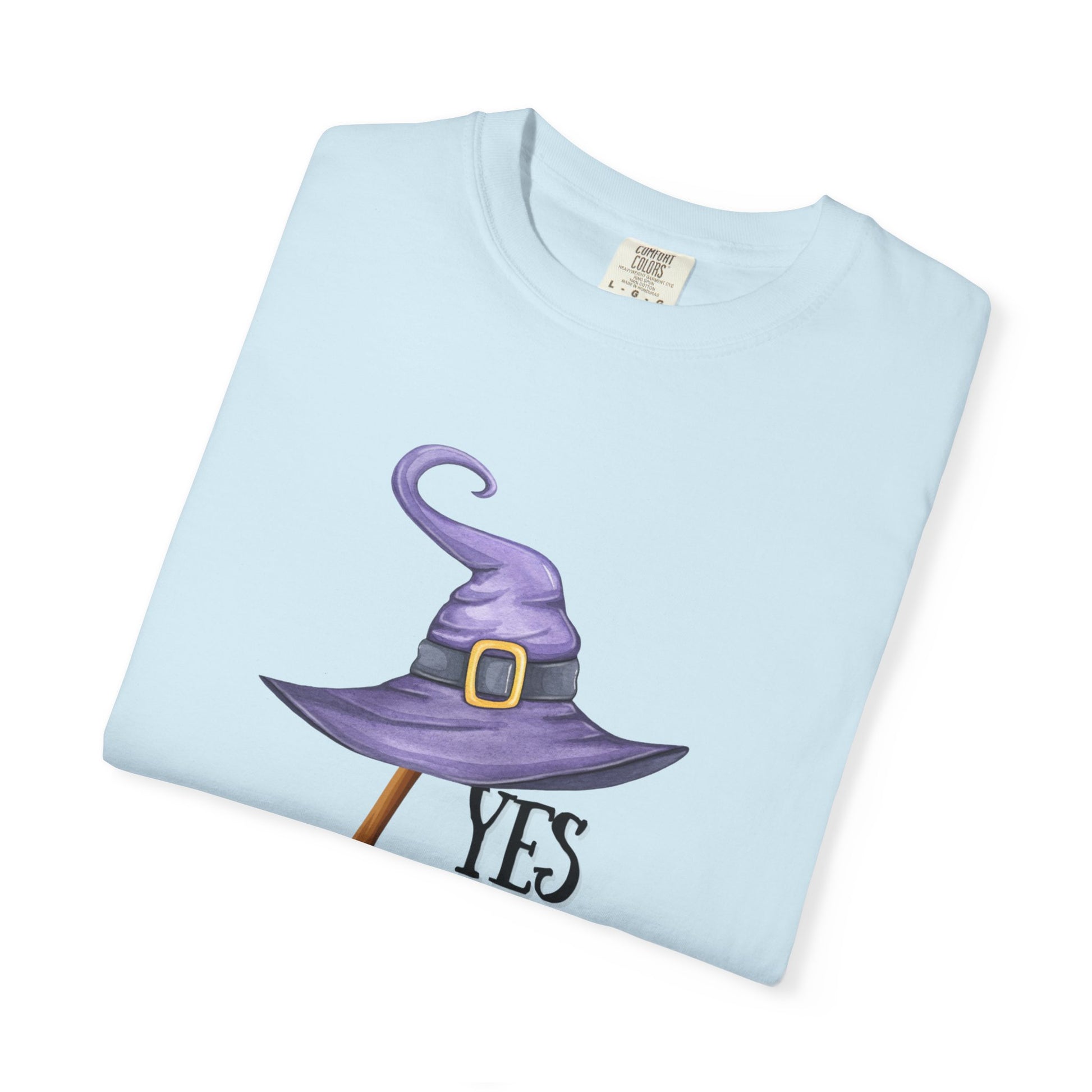 Light blue t-shirt with a purple witch hat graphic and 'YES' text on a white background