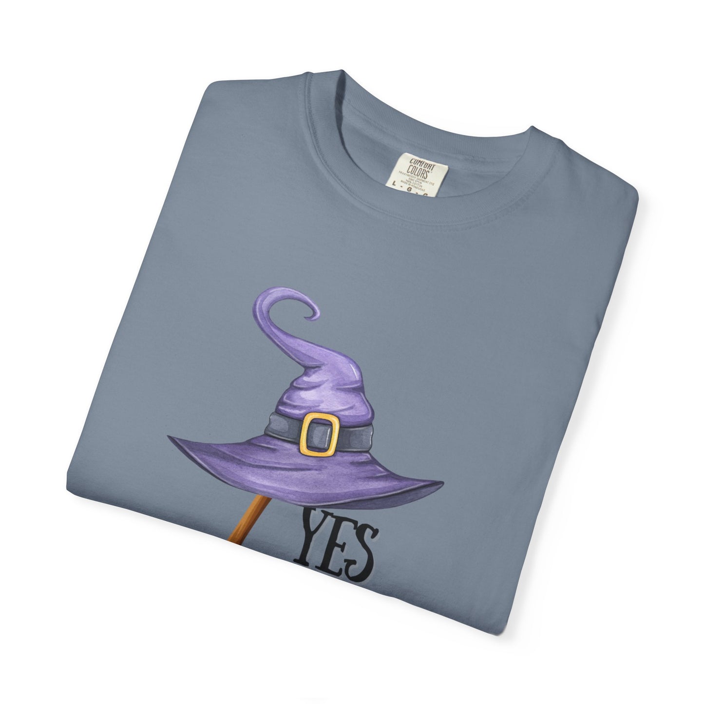 Folded t-shirt with a purple witch hat design on a white background
