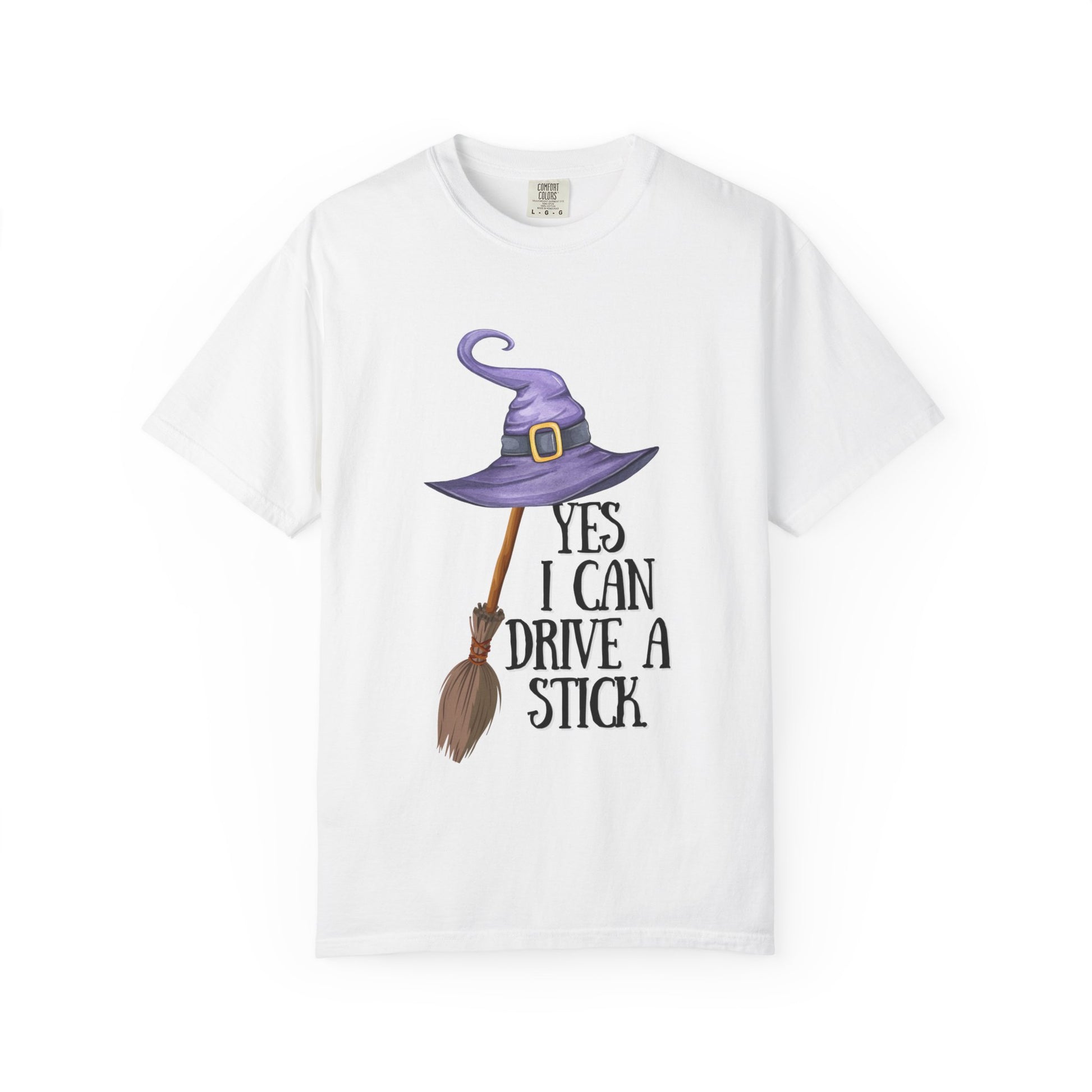 White t-shirt with a purple witch hat, broom, and text on a white background