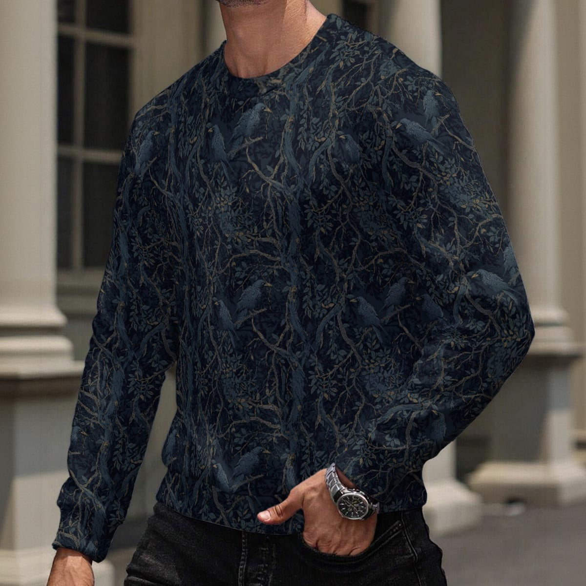 Person wearing a dark blue patterned sweater with a blurred background