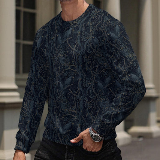 Person wearing a dark blue patterned sweater with a blurred background