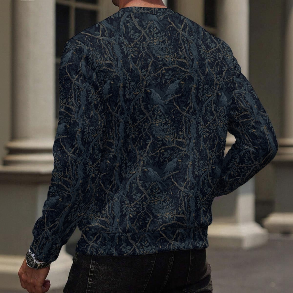 Person wearing a dark blue patterned sweater in an indoor setting