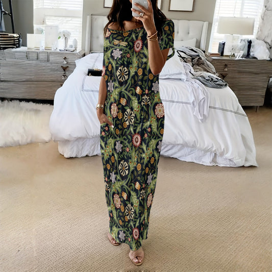 Woman taking a mirror selfie wearing a floral dress in a bedroom.