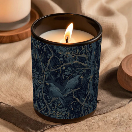 Candle in a blue patterned container on a beige fabric background
