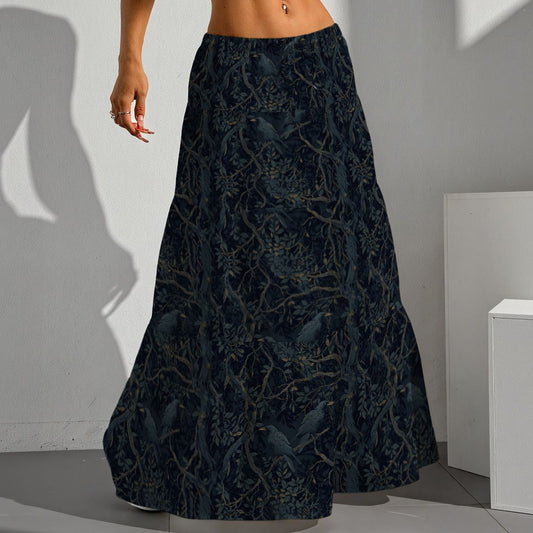 Person wearing a dark blue patterned skirt in a minimal indoor setting