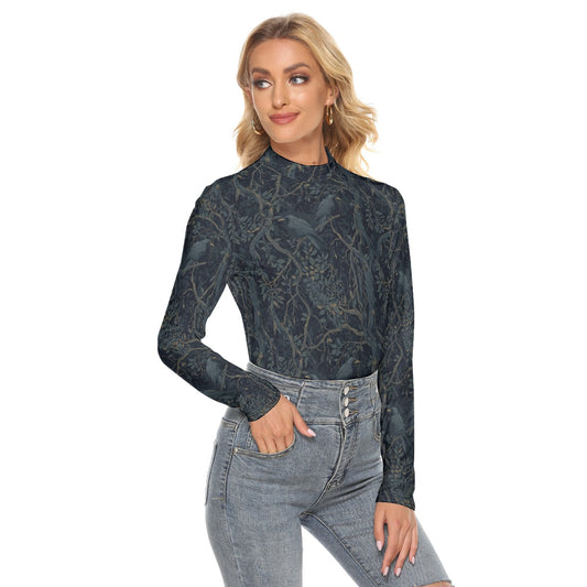 Woman wearing a dark patterned long-sleeve top and light blue jeans on a white background