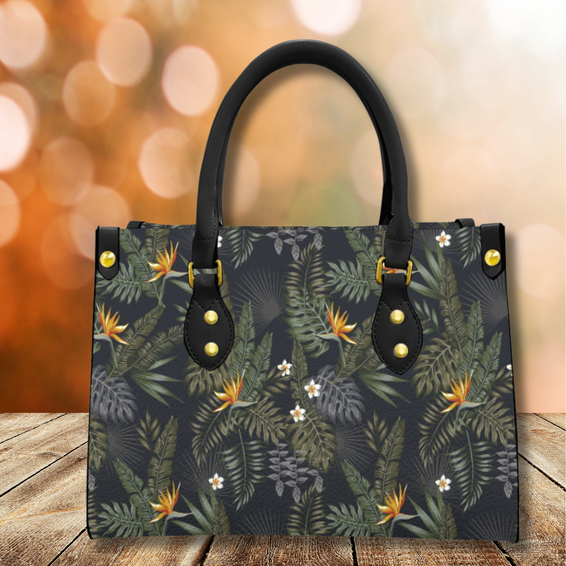 Handbag with floral pattern on a wooden surface with a blurred background
