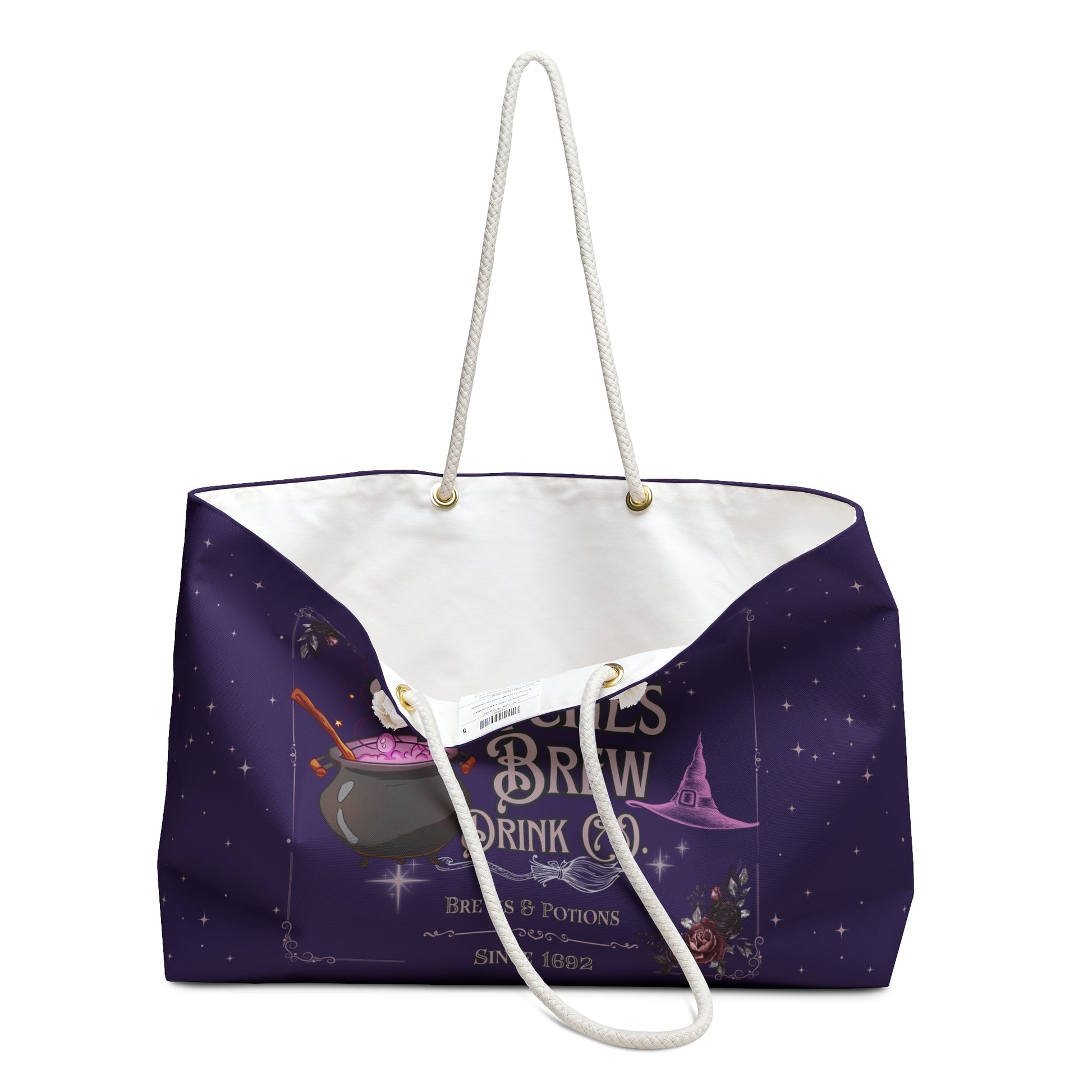 Purple tote bag with white handle featuring a witch-themed design on a white background