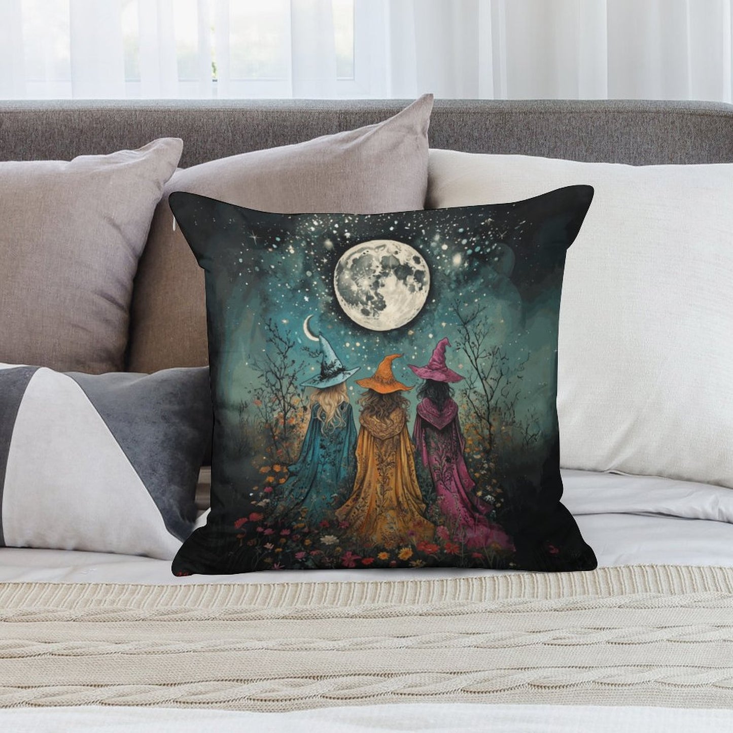 Decorative pillow with witch design on a couch