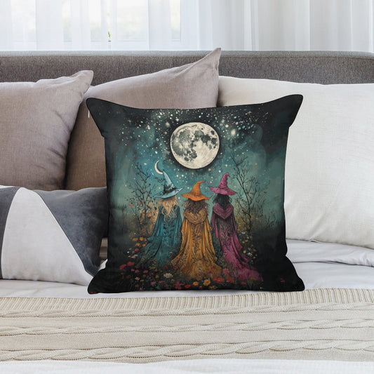 Decorative pillow with witch design on a couch