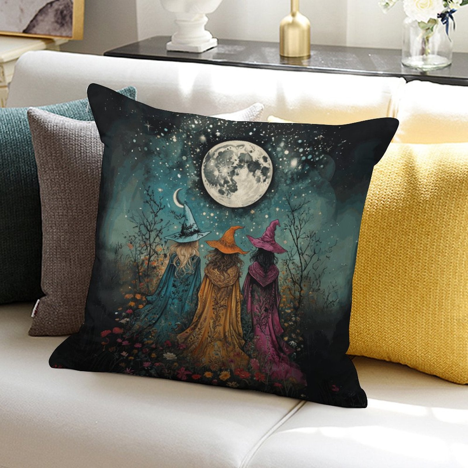 Decorative pillow with witch design on a couch