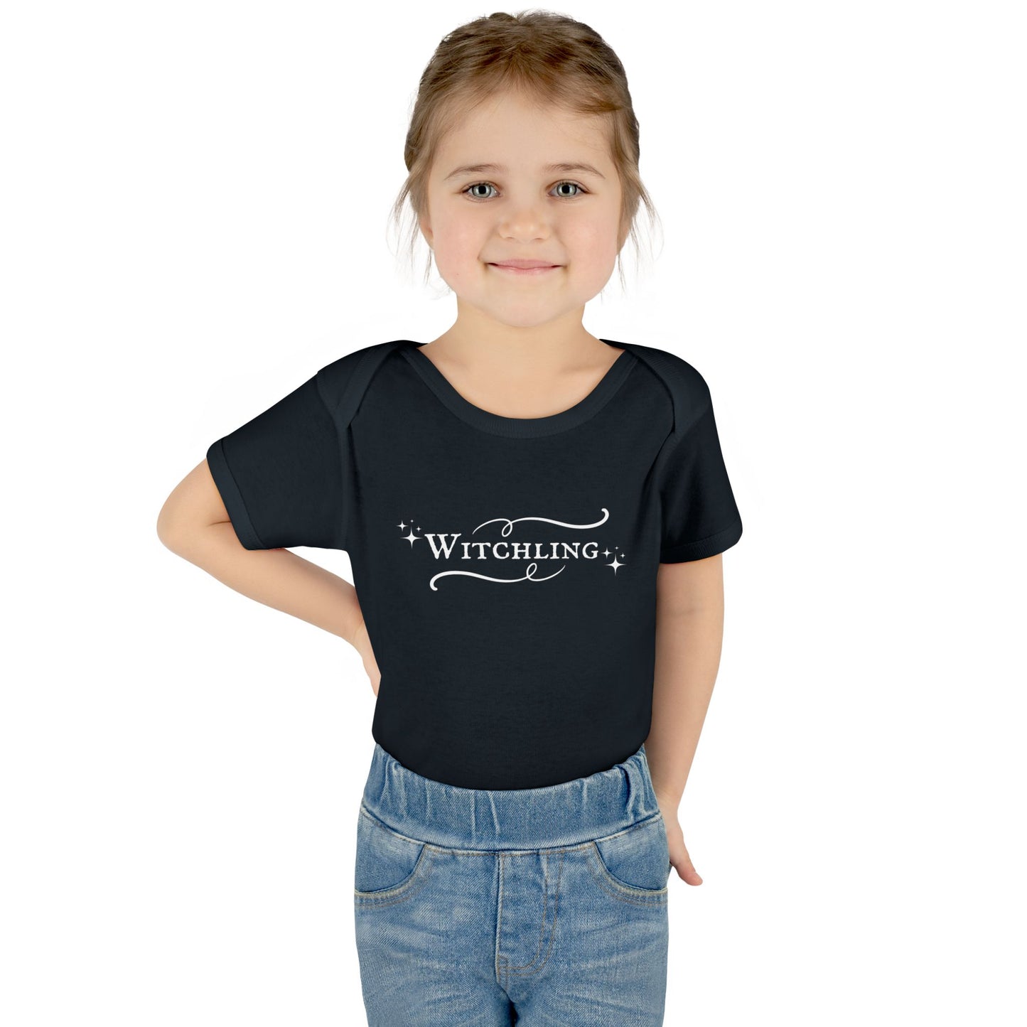 Child wearing a black t-shirt with 'Witchling' text on a white background