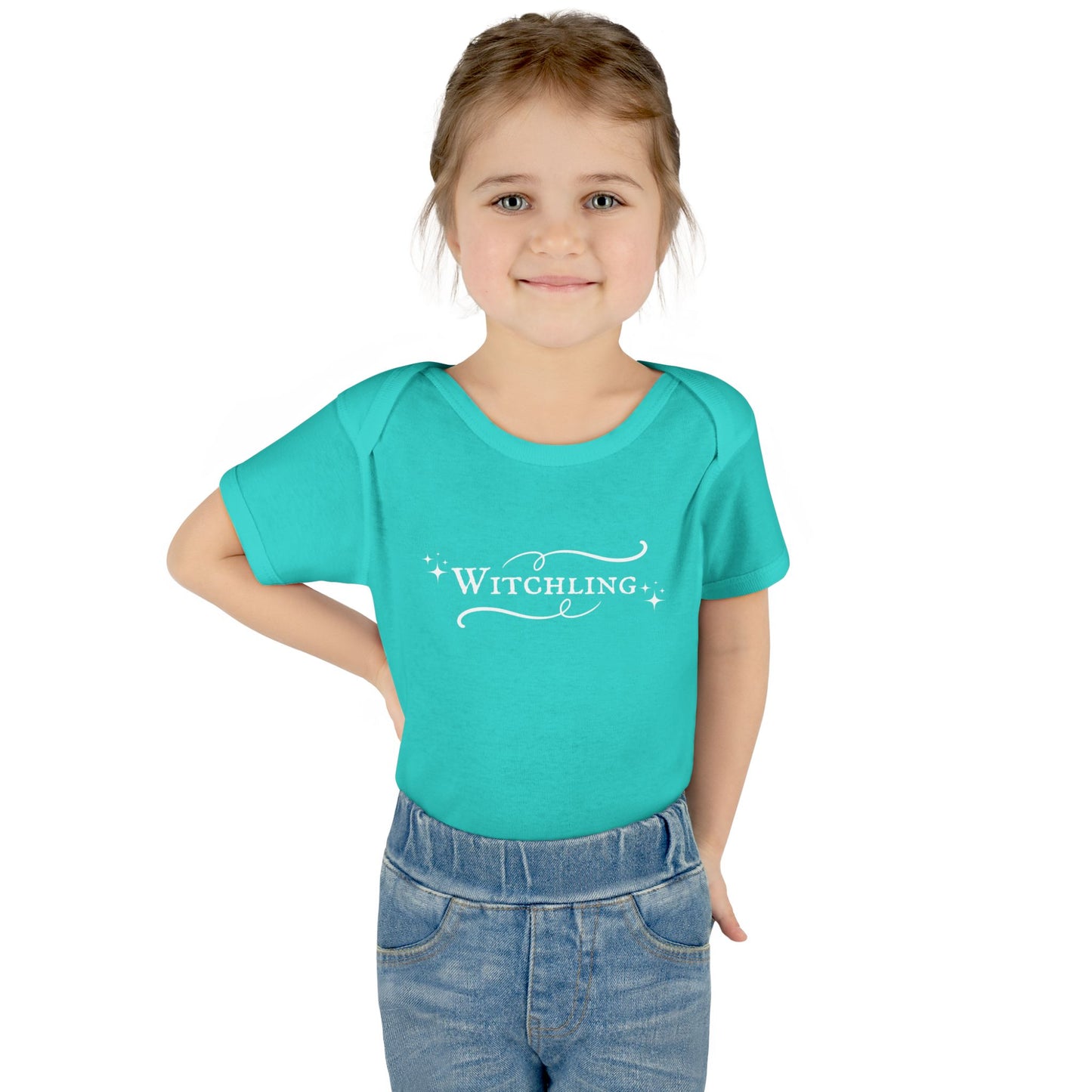 Child wearing a turquoise t-shirt with 'Witchling' text on a white background