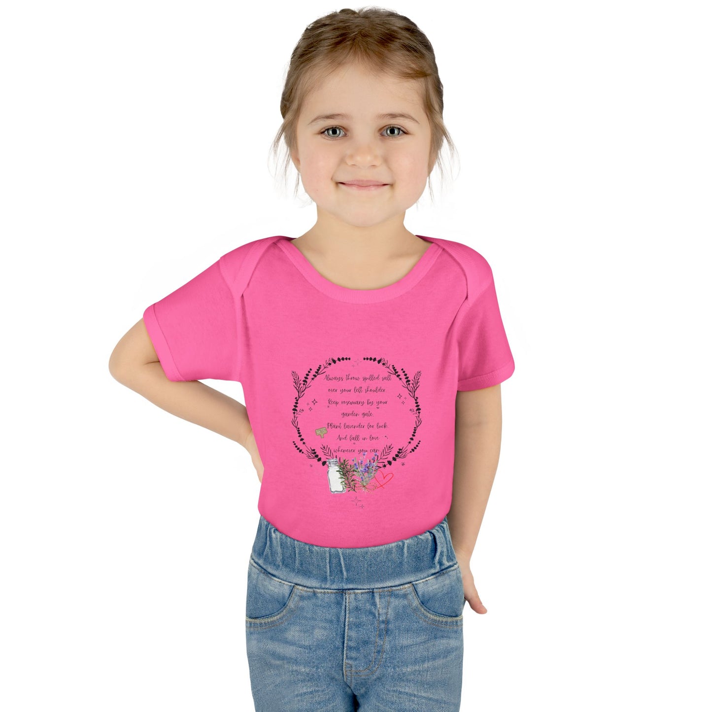 Young girl wearing a pink t-shirt with text and graphics on a white background